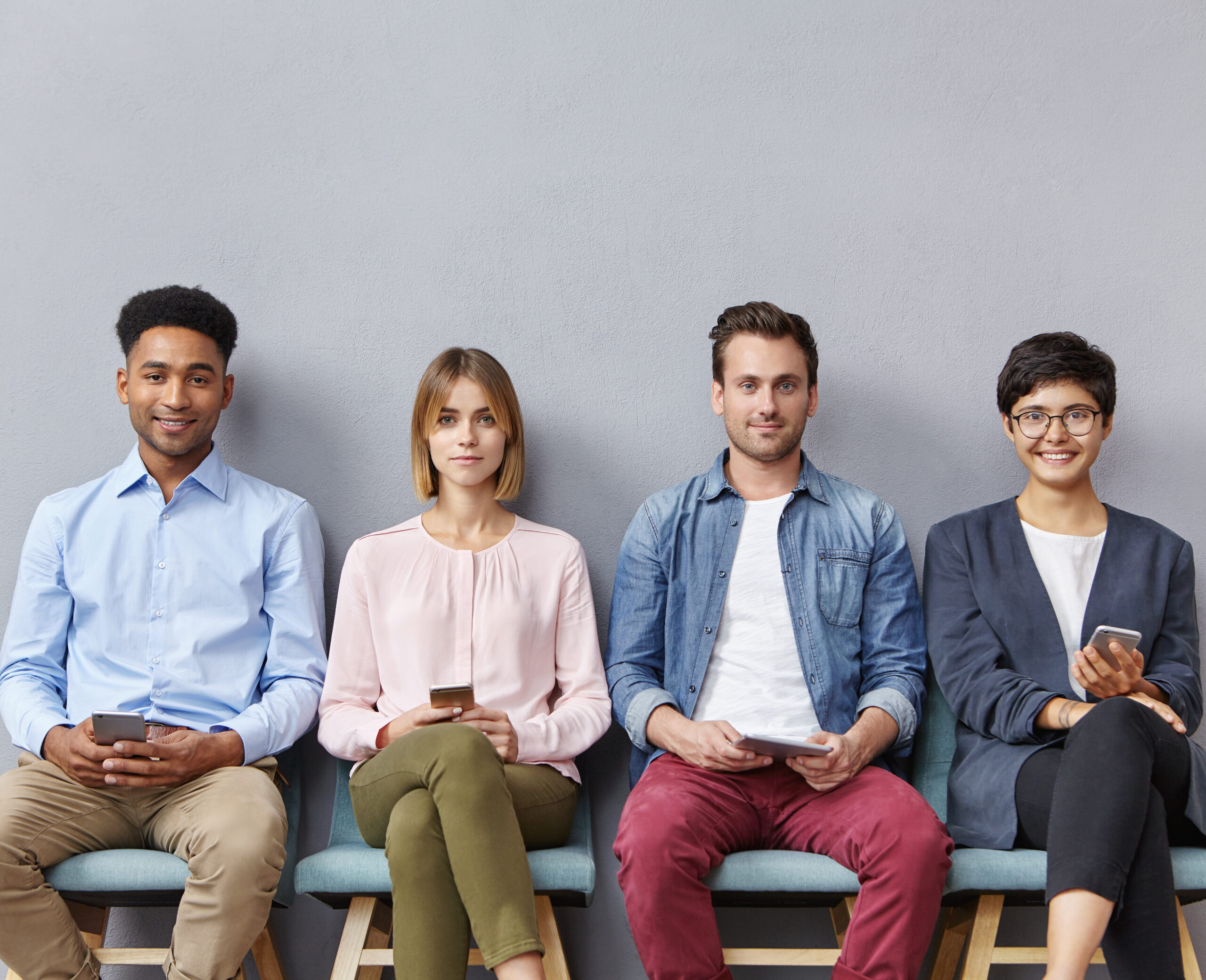 Four marketing interns sitting down